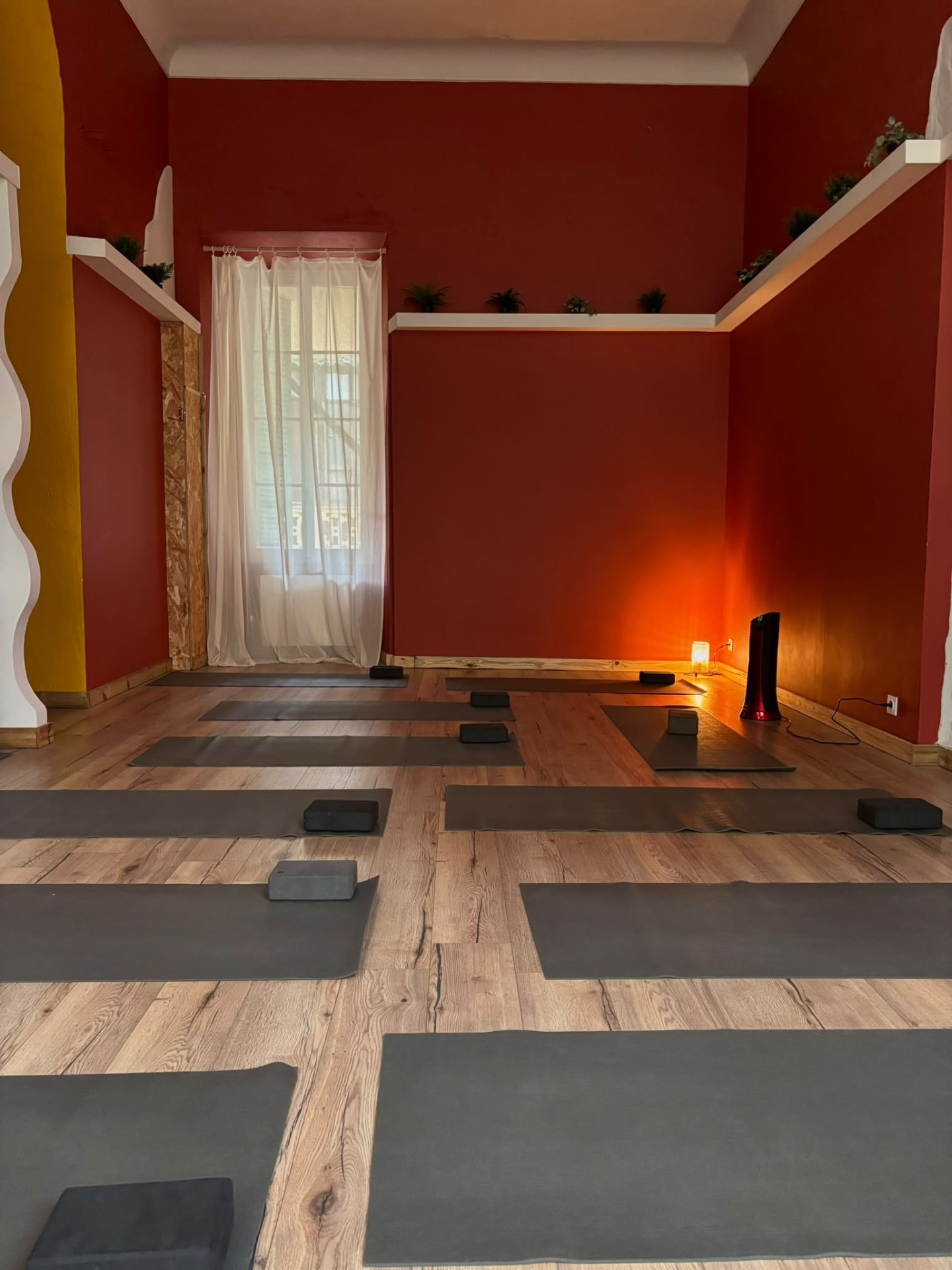 The Yoga Mala shala — mats and terracotta walls